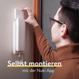 ✔️ Nuki Opener, elektronisches Türschloss für Mehrfamilienhäuser, steuert den Türöffner der Gegensprechanlage mit dem Smartphone, elektrischer Türöffner, WLAN Bridge erforderlich, Nuki Smart Home